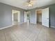 The bedroom includes neutral walls, tile flooring, and closet space at 5629 Nutmeg Ave, Sarasota, FL 34231