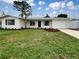 Charming single-story home featuring a well-manicured lawn and attached one car garage at 5629 Nutmeg Ave, Sarasota, FL 34231