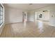 Spacious living room featuring neutral tones and a seamless flow into adjoining spaces at 5629 Nutmeg Ave, Sarasota, FL 34231