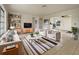 Bright living room with stylish furniture, decorative shelves, and a neutral color palette at 5629 Nutmeg Ave, Sarasota, FL 34231