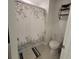 Bathroom with a toilet and shower behind a shower curtain at 13707 Newbridge St, Spring Hill, FL 34609