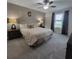 Comfortable bedroom showcasing a well-lit space, soft carpet, and a large bed, creating a relaxing atmosphere at 13707 Newbridge St, Spring Hill, FL 34609