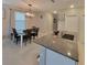 Open dining area with a table and granite counter top and ample counter space at 13707 Newbridge St, Spring Hill, FL 34609