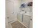 Well-lit laundry room with a washer and dryer at 13707 Newbridge St, Spring Hill, FL 34609