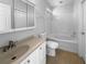 Clean bathroom with a tub, vanity, and tile flooring at 16006 Stags Leap Dr, Lutz, FL 33559
