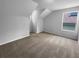 Attic bedroom with neutral walls, carpet flooring and a window at 16006 Stags Leap Dr, Lutz, FL 33559