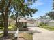 Charming single-Gathering home featuring a well-maintained lawn, two-car garage, and beautiful curb appeal at 16006 Stags Leap Dr, Lutz, FL 33559