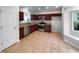 Stylish kitchen featuring stainless steel appliances, granite countertops, and tile flooring at 16006 Stags Leap Dr, Lutz, FL 33559