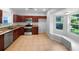 Well-equipped kitchen featuring stainless steel appliances, granite countertops, and tile flooring at 16006 Stags Leap Dr, Lutz, FL 33559