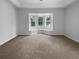 Large main bedroom featuring a cozy bay window seating area and plush carpeting at 16006 Stags Leap Dr, Lutz, FL 33559