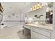 Bright bathroom featuring a soaking tub, white cabinets, and a large mirror, providing a clean aesthetic at 1716 Westerly Dr, Brandon, FL 33511