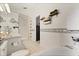 Bathroom with tub/shower featuring decorative tile accents, offering ample shelving and cabinet space at 1716 Westerly Dr, Brandon, FL 33511
