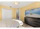 Bedroom featuring wood floors and a media center at 1716 Westerly Dr, Brandon, FL 33511