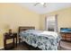 Cozy bedroom with yellow walls and a bed dressed in floral bedding at 1716 Westerly Dr, Brandon, FL 33511
