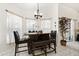 Dining area with a table, chairs, bench, and large windows at 1716 Westerly Dr, Brandon, FL 33511