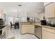 Bright kitchen with stainless steel dishwasher, tile flooring, and adjacent dining area at 1716 Westerly Dr, Brandon, FL 33511