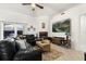 Cozy living room with a large sectional sofa, fireplace, wall-mounted TV, and natural light at 1716 Westerly Dr, Brandon, FL 33511