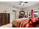 Main bedroom with a ceiling fan, dresser, and access to the lanai at 1716 Westerly Dr, Brandon, FL 33511