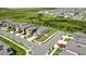 Aerial view of home with manicured front lawn and landscape, in a planned community at 9937 Aqua Miles Path, Wesley Chapel, FL 33545