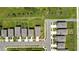 Aerial view shows a property's location relative to the street and neighboring houses at 9937 Aqua Miles Path, Wesley Chapel, FL 33545