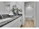 Elegant bathroom features granite countertop, dual sinks, and decor at 9937 Aqua Miles Path, Wesley Chapel, FL 33545