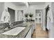 Modern bathroom featuring granite countertops, dual sinks, and ample storage with white cabinets and sleek fixtures at 9937 Aqua Miles Path, Wesley Chapel, FL 33545