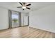 Bright bedroom featuring a window and ceiling fan at 9937 Aqua Miles Path, Wesley Chapel, FL 33545