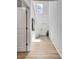 Bright foyer with wood-look floors, tall ceilings, and decorative accents for a welcoming entrance at 9937 Aqua Miles Path, Wesley Chapel, FL 33545