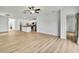 Spacious open-concept living area with ceiling fan and views of the kitchen at 9937 Aqua Miles Path, Wesley Chapel, FL 33545