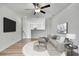 Inviting living room featuring modern decor, a large sofa, and stylish accents for comfortable living at 9937 Aqua Miles Path, Wesley Chapel, FL 33545