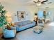 Cozy living room with modern decor, comfortable seating, and ample natural light at 9937 Aqua Miles Path, Wesley Chapel, FL 33545