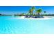 Beautiful view of the beach area with clear blue water and lounge chairs near the pool at 9937 Aqua Miles Path, Wesley Chapel, FL 33545