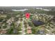 Expansive view of a lakeside community surrounded by lush green trees at 17032 Winners Cir, Odessa, FL 33556