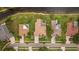 Aerial view of the property, neighboring homes, and picturesque, walkable neighborhood at 17032 Winners Cir, Odessa, FL 33556