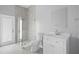 Modern bathroom with glass-enclosed shower and single vanity at 17032 Winners Cir, Odessa, FL 33556