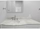 Bathroom featuring marble countertop, sink, and a large mirror at 17032 Winners Cir, Odessa, FL 33556