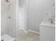 Tiled walk-in shower, vanity and sink are on display in this bathroom at 17032 Winners Cir, Odessa, FL 33556