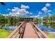 Waterside gazebo offers a place to relax and enjoy the natural beauty of the surrounding community at 17032 Winners Cir, Odessa, FL 33556