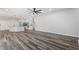 Spacious open concept living area features hardwood floors and an island kitchen at 17032 Winners Cir, Odessa, FL 33556