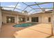 Enclosed pool area featuring an in-ground pool, and a large deck area for lounging at 17032 Winners Cir, Odessa, FL 33556