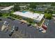 Aerial view of the community center, pool, parking lot, and solar panel array at this condo complex at 2257 World Parkway W Blvd # 61, Clearwater, FL 33763