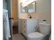 Bathroom showcasing updated vanity with black faucet and gray floors at 2257 World Parkway W Blvd # 61, Clearwater, FL 33763