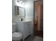 Bathroom featuring stylish white vanity and gray floors at 2257 World Parkway W Blvd # 61, Clearwater, FL 33763
