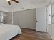 This bedroom features a ceiling fan and a large closet with sliding doors, complemented by sleek, modern hardware at 2257 World Parkway W Blvd # 61, Clearwater, FL 33763