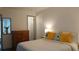 Bright bedroom with light tones, featuring a patterned dresser, creating a cozy retreat at 2257 World Parkway W Blvd # 61, Clearwater, FL 33763
