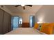 Cozy bedroom with neutral tones, featuring a ceiling fan and a closet, creating a serene retreat at 2257 World Parkway W Blvd # 61, Clearwater, FL 33763