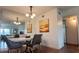 Modern dining room with a sleek table, stylish chairs, a mirror, and contemporary decor at 2257 World Parkway W Blvd # 61, Clearwater, FL 33763