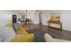 Open-concept living and dining room with wood floors and bright, neutral decor at 2257 World Parkway W Blvd # 61, Clearwater, FL 33763