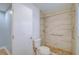 Modern bathroom with tiled shower, safety rail, and mosaic tile floor at 2813 21St W Ave, Bradenton, FL 34205