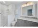 Updated bathroom featuring a shower, vanity with marble top, and decorative mosaic tiles at 2813 21St W Ave, Bradenton, FL 34205
